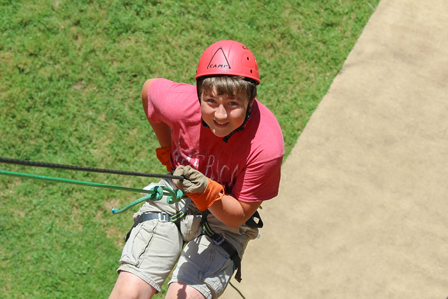 Scout repelling down wall at custaloga town