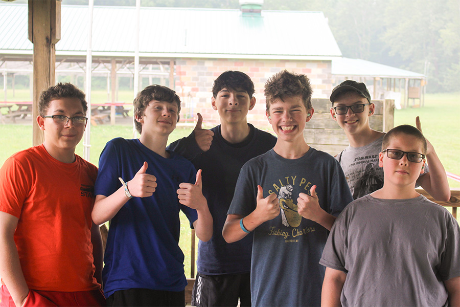 Sporting Clays Smiling scouts with thumbs up at shooting range